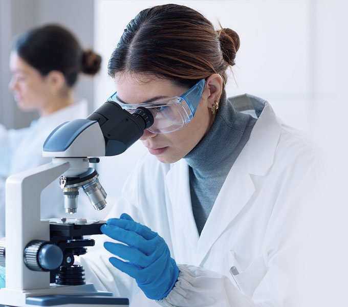 Lab technician managing sample data with Revollims LIMS software